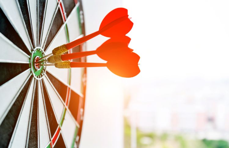 target market examples - target with three red tailed darts in bullseye