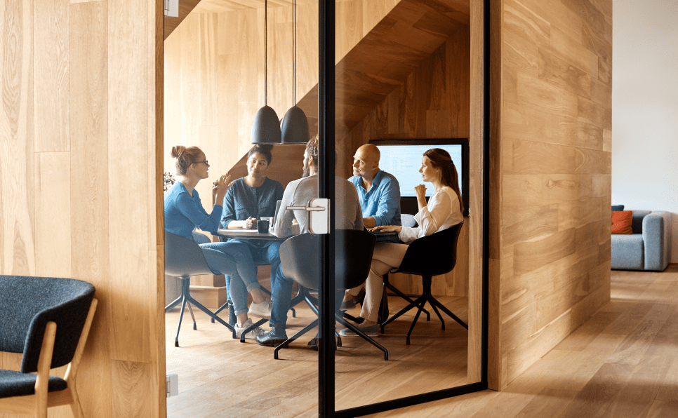 Colleagues having a meeting in an office space