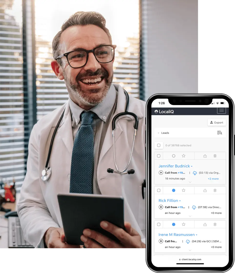 Doctor smiling, holding a smartphone which shows LocalIQ marketing dashboard
