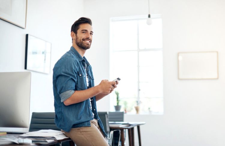 small business owner planning social media strategy on phone