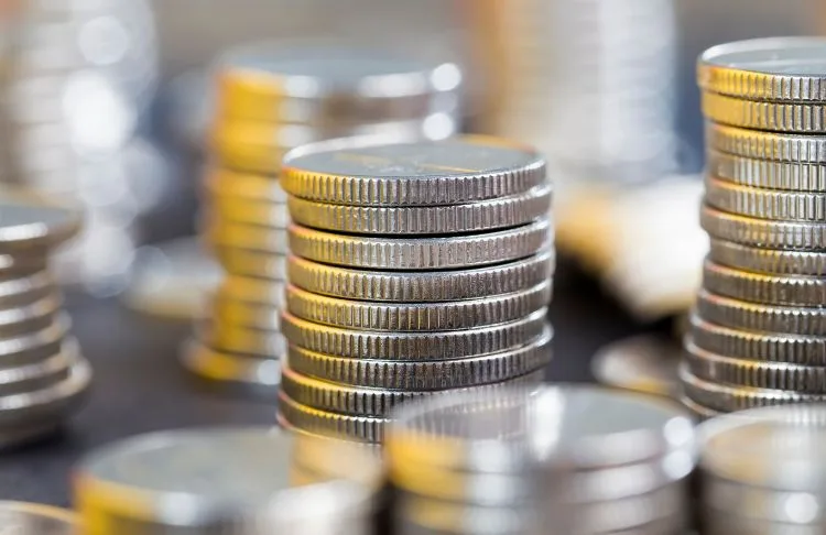 small business tariffs impact - stack of quarters