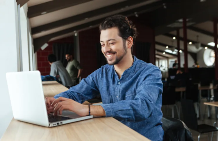 Display ads - man sits at a laptop.