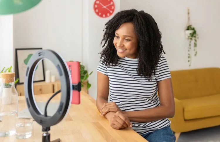 TikTok SEO - Women in professional attire recording herself.