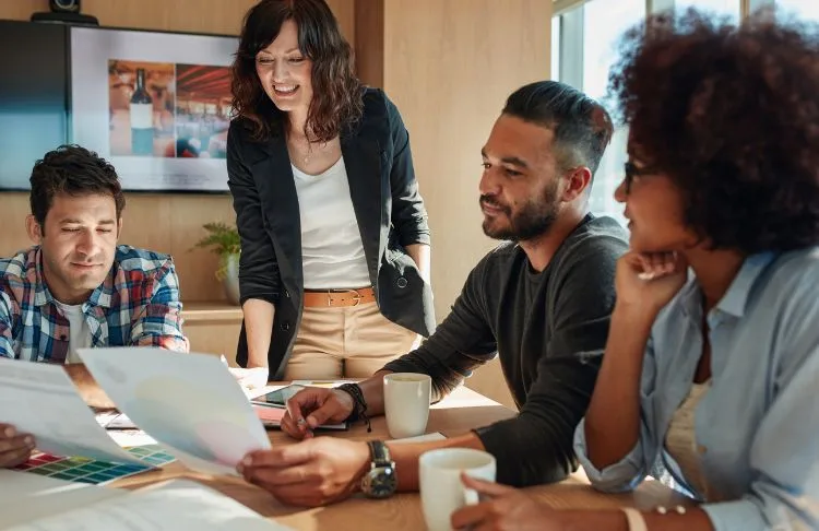 agency employees looking at benchmark reports