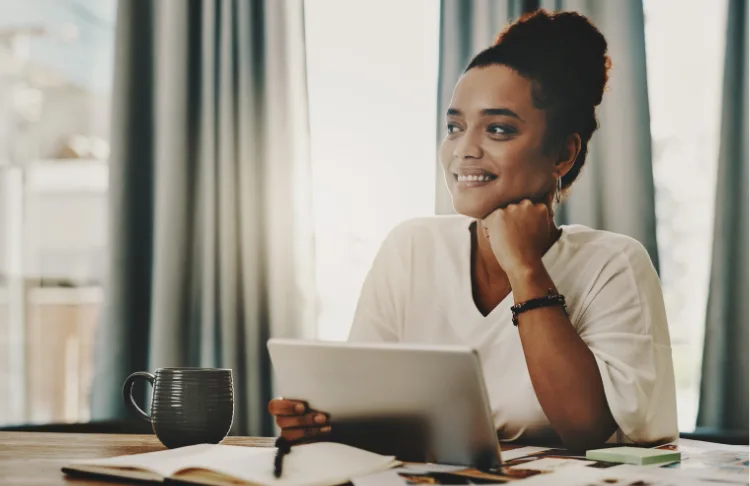 GEO for SMBs - business woman sits with a laptop