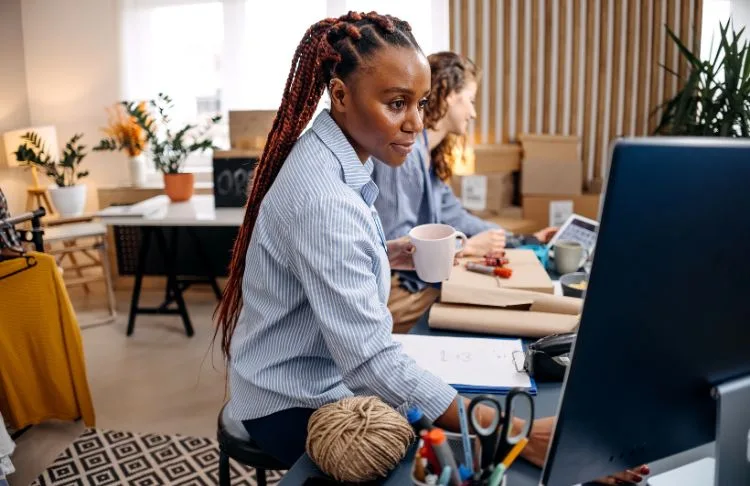 female business owner using computer in office
