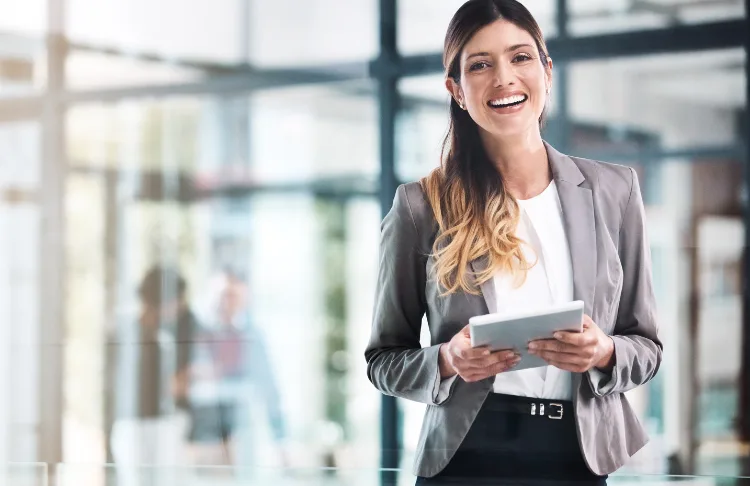 Small business marketing plan - business woman holding a tablet