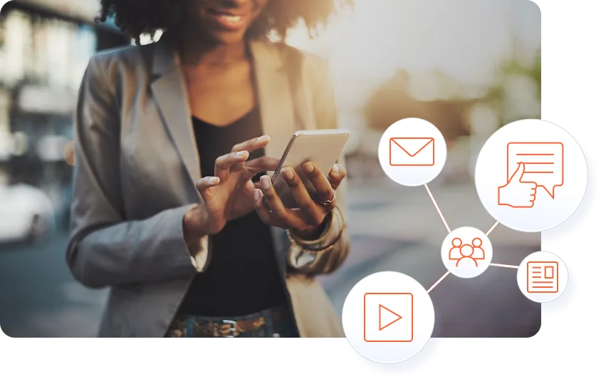 Woman using a mobile phone while reviewing digital marketing engagement and conversion metrics